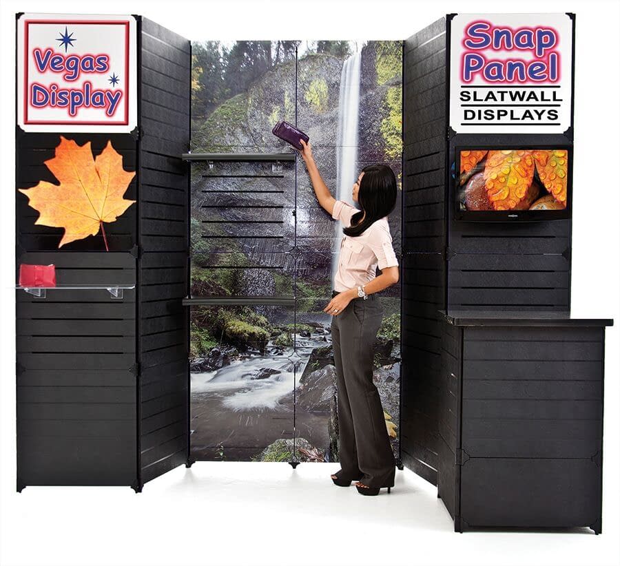 Expo Kit COMPLETE — All-in-One 10×10 Modular Slatwall Trade Show DisplayThe Expo Kit COMPLETE has everything you need to create a professional, turnkey 10×10 trade show display—all in one affordable, easy-to-use package. This modular slatwall display system is perfect for exhibitors, sales reps, and product-based businesses that want a clean, branded presentation without the hassle of bulky hardware or long setup times.  The Expo Kit COMPLETE includes all the components from our standard Expo Kit, plus LED spotlights and a durable hard shipping case with wheels for easy transport. You’ll also receive a Snap Panel counter with built-in storage, shelves, and hooks—everything you need to showcase your products beautifully.  Each 2′×2′ panel weighs only 5 lbs and features six slats on one side and a smooth finish on the reverse. The entire display can be set up or broken down by one person in minutes—no tools required. As your exhibit needs grow, you can easily expand your system by adding additional Snap Panels and connectors.  Backed by over 10 years of trade show experience from our parent company, Vegas Display, the Snap Panel system is a proven, reliable display solution trusted by thousands of exhibitors nationwide. With inventory in stock and ready to ship from our Las Vegas warehouse, you can always count on fast delivery and responsive support.  ✅ Complete 10×10 Display Kit: Includes counter, shelves, hooks, LED spotlights, and hard shipping case. ✅ Modular & Expandable: Add more panels as your display needs grow. ✅ Lightweight & Durable: Each panel weighs just 5 lbs. ✅ Tool-Free Setup: Fast, one-person assembly in minutes. ✅ Trusted System: Proven in the Las Vegas trade show industry for over a decade. ✅ Ships Fast: In stock and ready to ship from Las Vegas.Save $325.